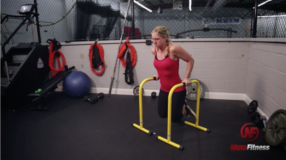Staci-doing-parallel-bar-dip-exercise.png